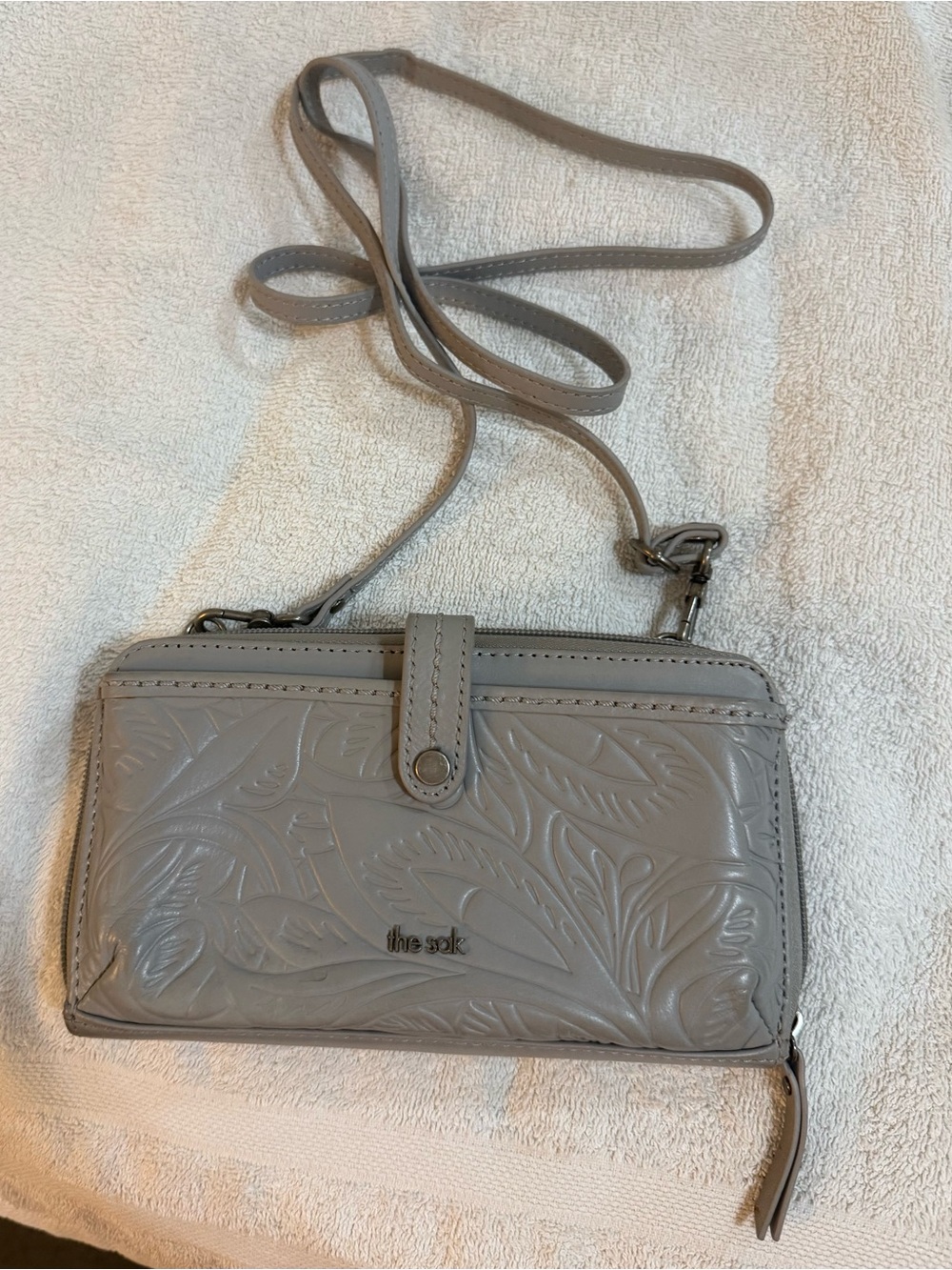 The Sak Gray Embossed Floral Crossbody Wallet